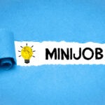 Steuerberatung Reindl, Hergenröder und Partner - Schriftzug Minijob auf blauem Hintergrund