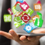 Steuerberatung Reindl, Hergenröder und Partner - App-Symbole schweben über einem Handy